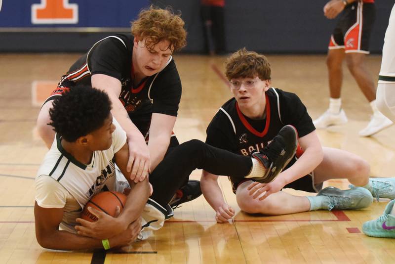 Bradley-Bourbonnais' Andrew Mathews, top left, and Carter Borneman battle Vaugh/St. Patrick's Pierre Brown for a loose ball during the IHSA Class 2A Special Olympics Unified State championship game at the University of Illinois' Activities and Recreation Center Saturday, March 14, 2026.