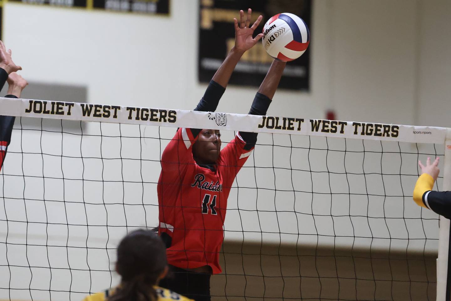 Bolingbrook’s Sydney Anderson goes for the block against Joliet West. Tuesday, Aug. 23, 2022, in Joliet.