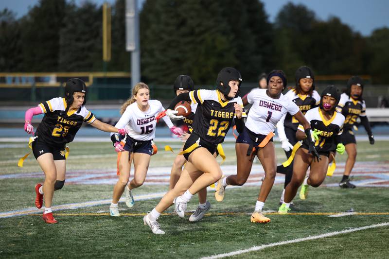 Joliet West's Zoe Walsh runs the ball during the Tigers' 13-7 loss to Oswego on Tuesday, Oct. 7, 2025.