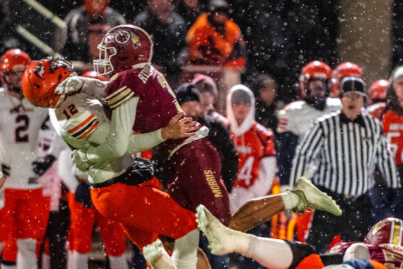 Morris's Sam Reddinger takes down Mahomet-Seymour's Wyatt Bohm during the IHSA Quarterfinals Saturday Nov. 12, 2022 at Morris  High School