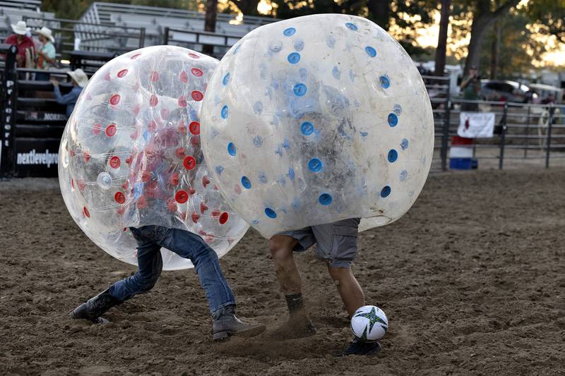 Competitors duke it out in a game of full contact bubble soccer Wednesday, August 13, 2025, at the Whiteside County Fair during the Next Level Pro Bronc rodeo.