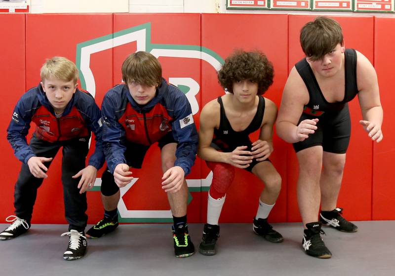 LP Crunching Cavs Youth Wrestling Club members (from left) Griffin Kellett, Landyn Mcemery, Wyatt Mikkelsen and Alex Tucker gather for a photo on Wednesday, March 8, 2023 at L-P High School.