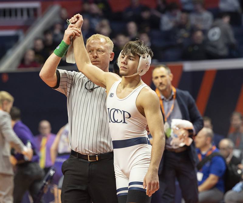 IC Catholic’s Deven Casey celebrates his win over Civic Memorial’s Bradley Ruckman in the 132 pound weight class of the 2A state individual wrestling finals Saturday, Feb. 22, 2025, at State Farm Center in Champaign.