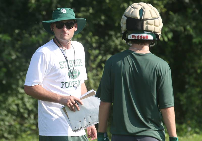 St. Bede head football coach Jack Brady watches his team run drills during the first day of football practice on Monday, Aug. 11, 2025 at St. Bede Academy.