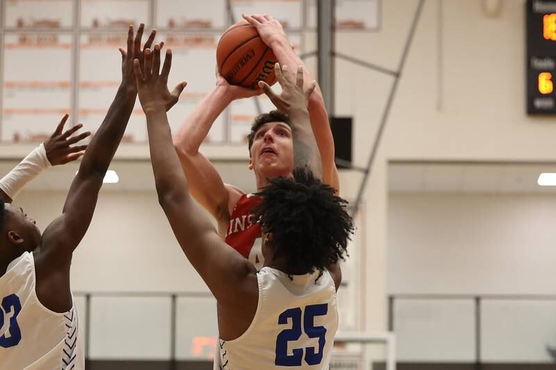 Hinsdale Central’s Chase Collignon puts up the contested shot against Lincoln-Way East in the Lincoln-Way West Warrior Showdown on Saturday January 28th, 2023.