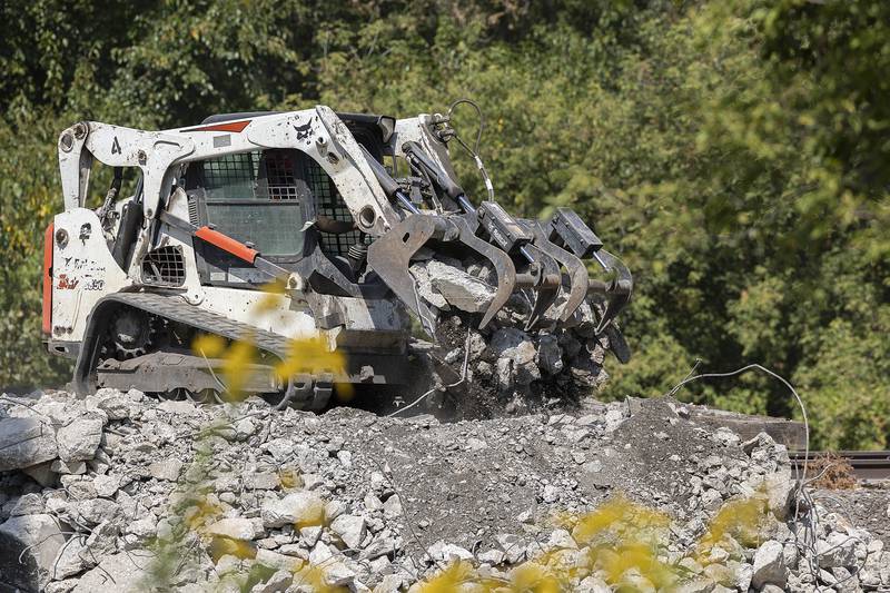 Debris is moved aside Wednesday, Sept. 17, 2025, at the site of the coal tower demolition.
