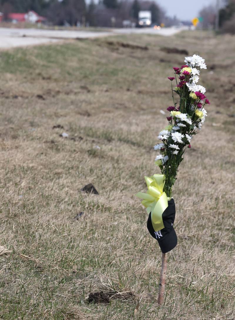 A memorial has been put up Friday, March 29, 2024, at the site on Route 23 three-quarters of a mile south Perry Road, where  DeKalb County Sheriff’s Deputy Christina Musil, 35, died in a crash while working a shift Thursday night.