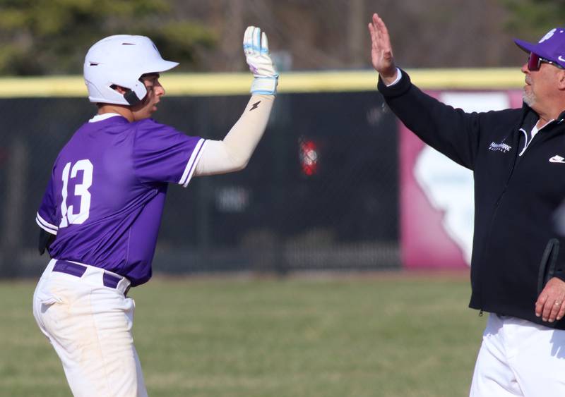 Hampshire’s Nathan Kolder is greeted after connecting for a single in varsity baseball on Wednesday, April 16, 2025, at Prairie Ridge High School in Crystal Lake.