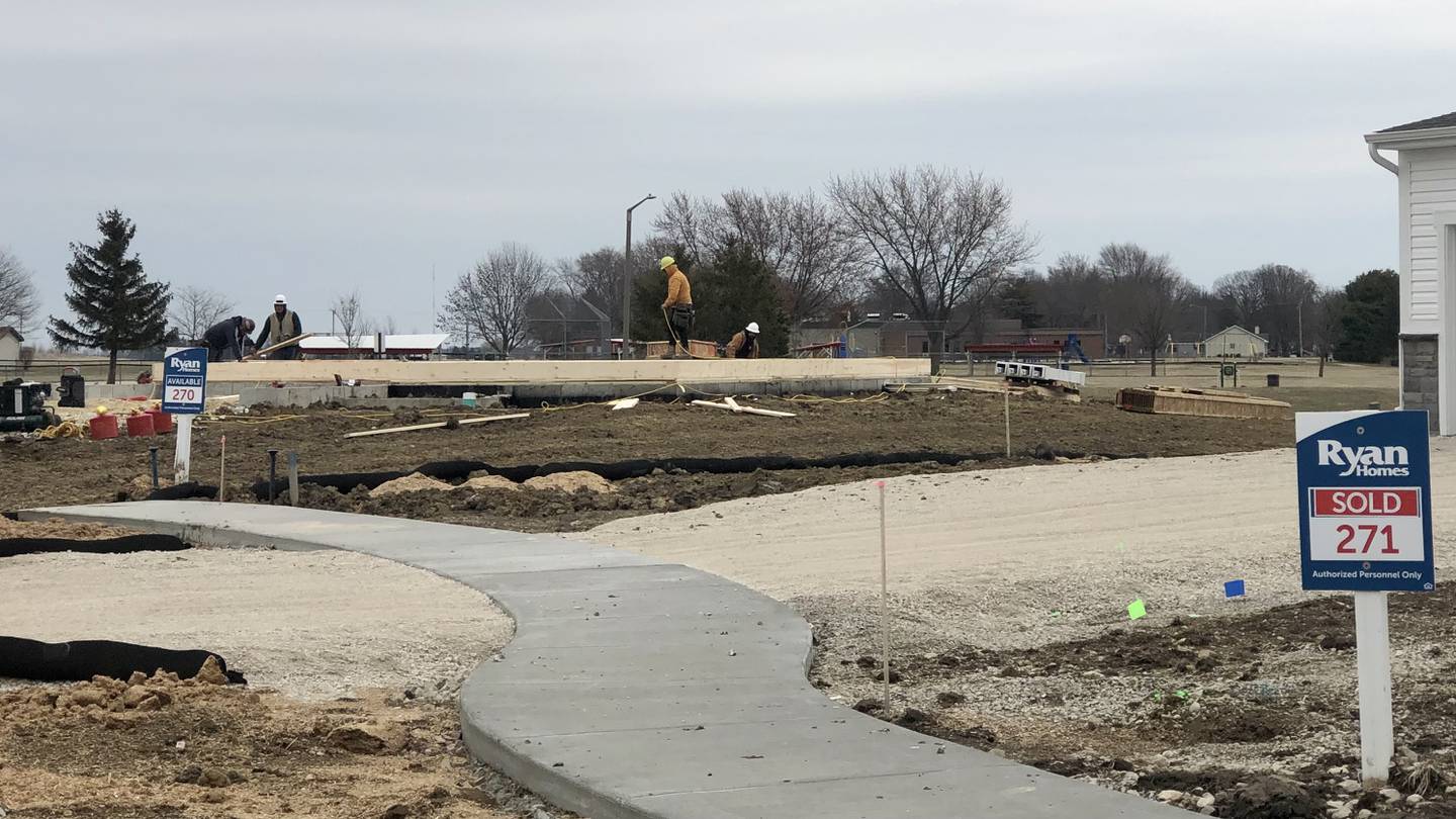 Construction workers lay foundation on Thursday, March 16, 2023 on South Park View Court, for one of several homes being constructed by developer Ryan Homes in the Fairwinds subdivision in Sandwich.