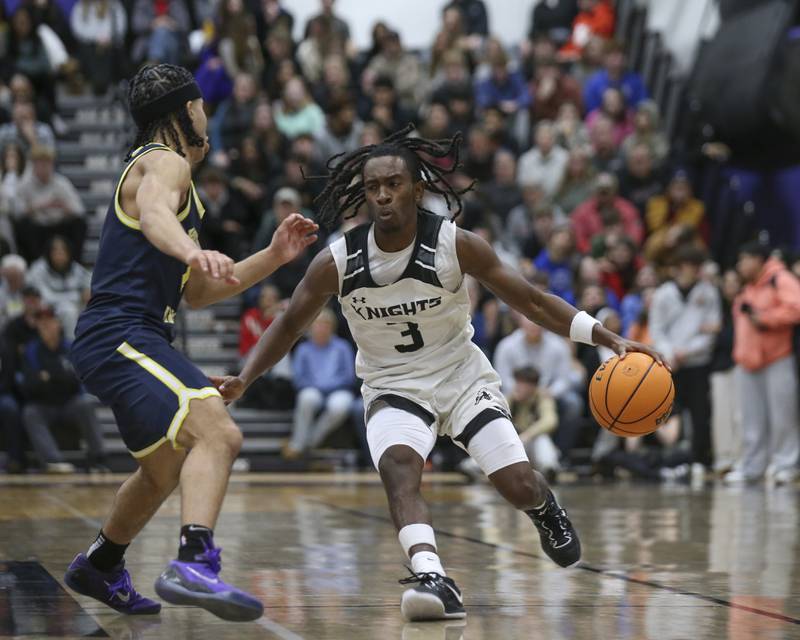 Kaneland's Marshawn Cocroft (3) handles the ball against the defense of Yorkville Christian's Tray Alford (4) during their Plano Christmas Classic Championship basketball game between Yorkville Christian at Kaneland Tuesday, Dec 30, 2025 in Plano.