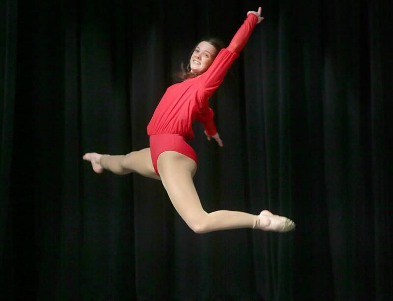 Ottawa Township High School student Whitney Stone performs a ballet routine in mid-air during the 48th annual Fine Arts Festival on Thursday, March 17, 2022 at Ottawa High School.