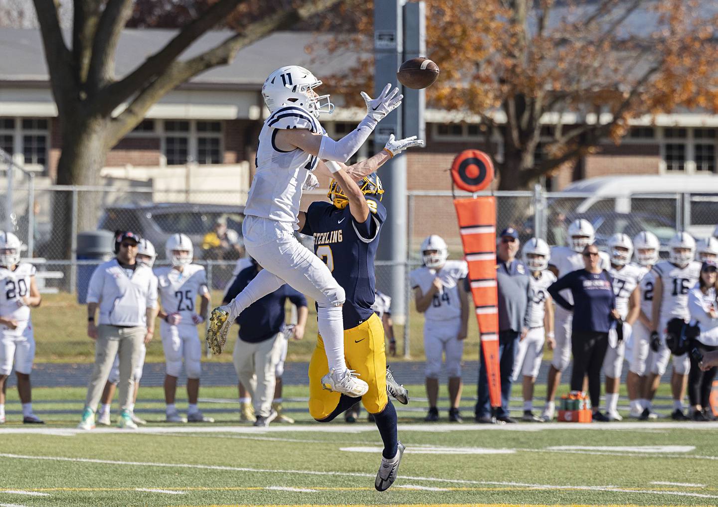 St. Viator’s Michael Nix hauls in a catch over Sterling’s JP Schilling in their first round playoff game Saturday, Oct. 29, 2022 against. The big gain was called back because of a penalty. Both teams lost several large gains due to yellow flags.