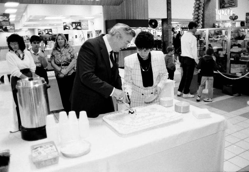 Bergner's employees cut an anniversary cake in the 1980's inside the Peru Mall.