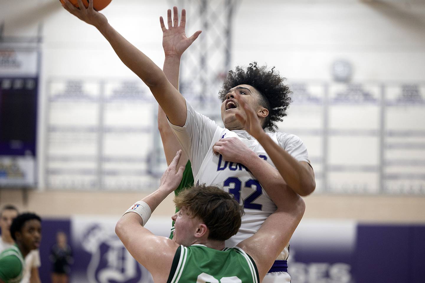 Dixon’s Darius Harrington puts up a shot below the basket against Geneseo’s Landon Nordstrom Monday, Nov. 25, 2024.