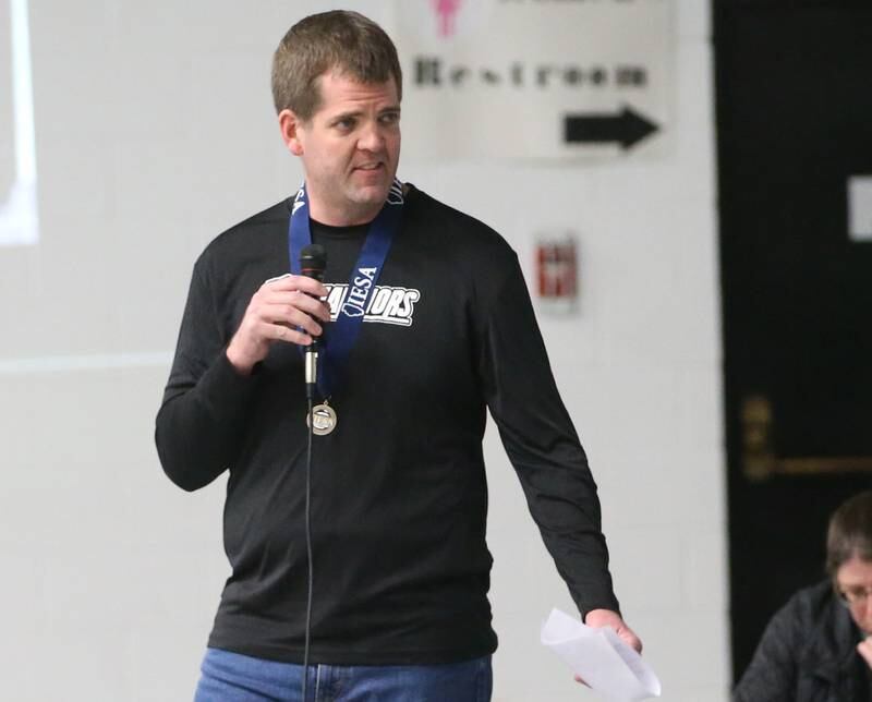 Mendota Holy Cross eighth-grade boys basketball coach Luke Tillman delivers a speech to his team during a reception on Tuesday, Feb. 20, 2024 at Holy Cross School. The team beat Pana Sacred Heart 41-33 to win the IESA Class 1A State championship.