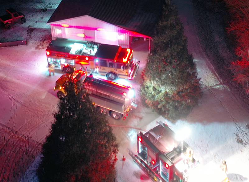 An aerial view of firefighters working the scene of a structure fire in the 3000 block of East 550th Road on Saturday, Jan. 31, 2026 in Mendota. The fire started in the chimney area. Fire departments from Troy Grove, Utica, La Salle, Peru, Mendota, and others across the region were dispatched shortly after 10p.m.