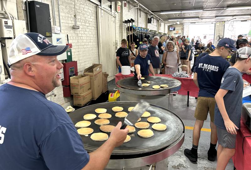 Mt. Morris firefighters and volunteers were very busy on Friday morning, July 4, 2025 cooking breakfast at the fire station. The event is an annual fundraiser for the fire protection district.