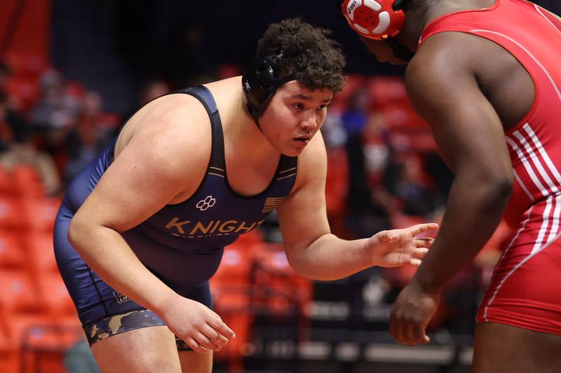 IC Catholic Prep’s Isaiah Gonzalez works against Mooseheart’s Joshua Gaye in the Class 1A 285lb. semifinals at State Farm Center in Champaign. Friday, Feb. 18, 2022, in Champaign.