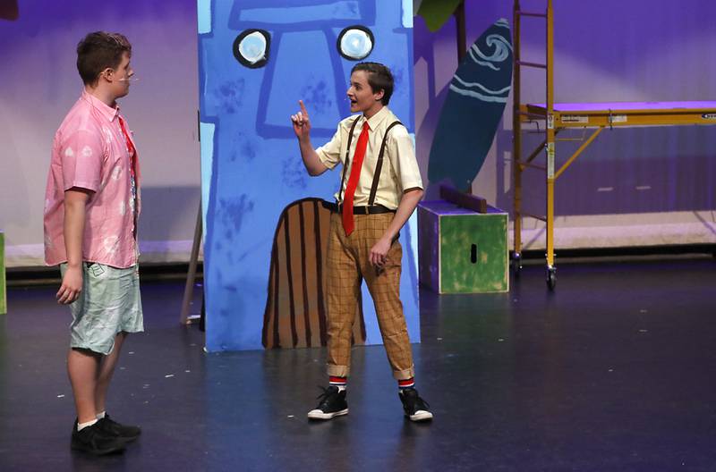 Jamison Shea, playing Patrick Star, and Kadin Henige, playing SpongeBob SquarePants, rehearse a scene from the McHenry Community High School’s production of “The SpongeBob Musical” on Tuesday, March 7, 2023, at the school’s Upper Campus.