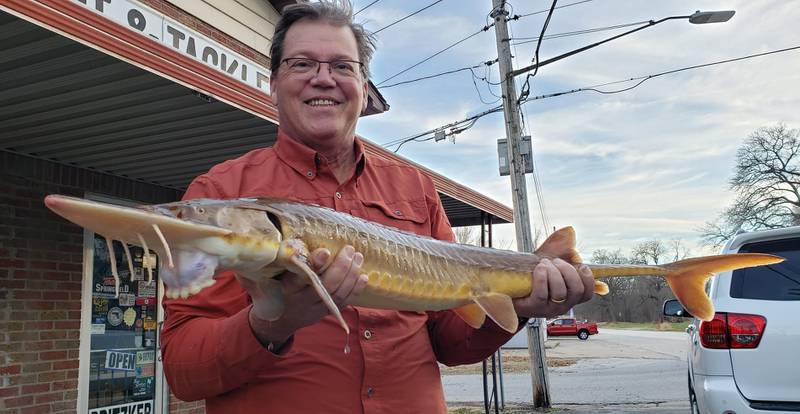 Marty Gustafson, 58, of Prophetstown, holds his potentially state-record-breaking shovelnose sturgeon that he caught in the Rock River on Dec. 12, 2021. It weighed in at 10 pound, 8.2-ounces, beating the previous record, broken less than a month before by his nephew and fishing buddy, Troy Gustafson of Port Byron.