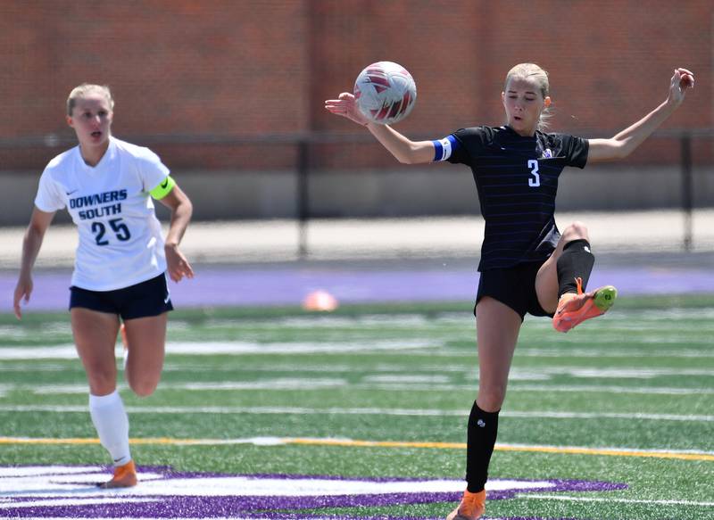 Downers Grove North’s Audrey Carlstead (3) kicks the ball away from Downers Grove South’s Skylar Swanson (25) during a game on May 10, 2025 at Downers Grove North High School in Downers Grove .