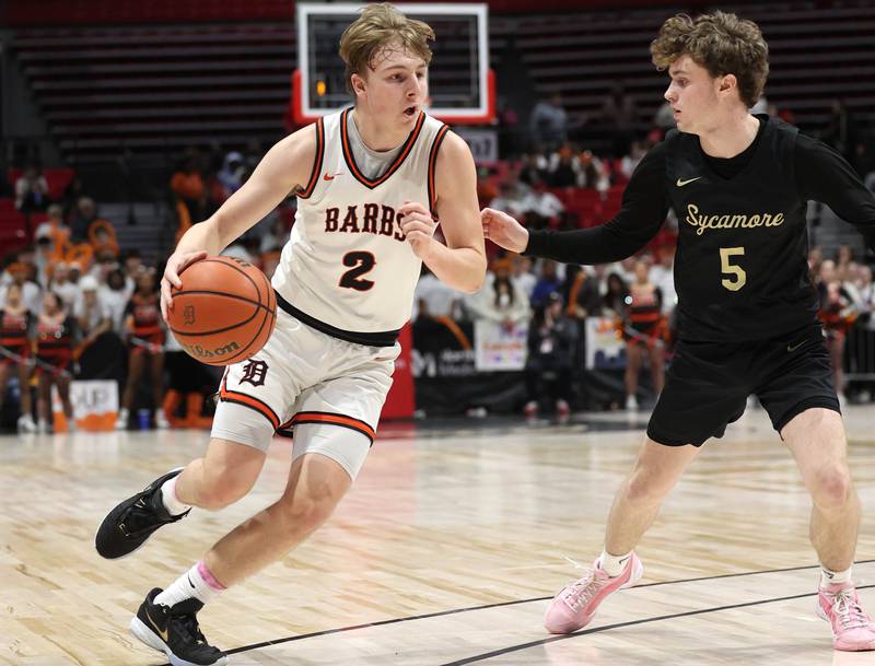 DeKalb’s Sean Reynolds looks to get around Sycamore's Preston Picolotti Friday, Jan. 26, 2024, during the FNBO Challenge in the Convocation Center at Northern Illinois University.