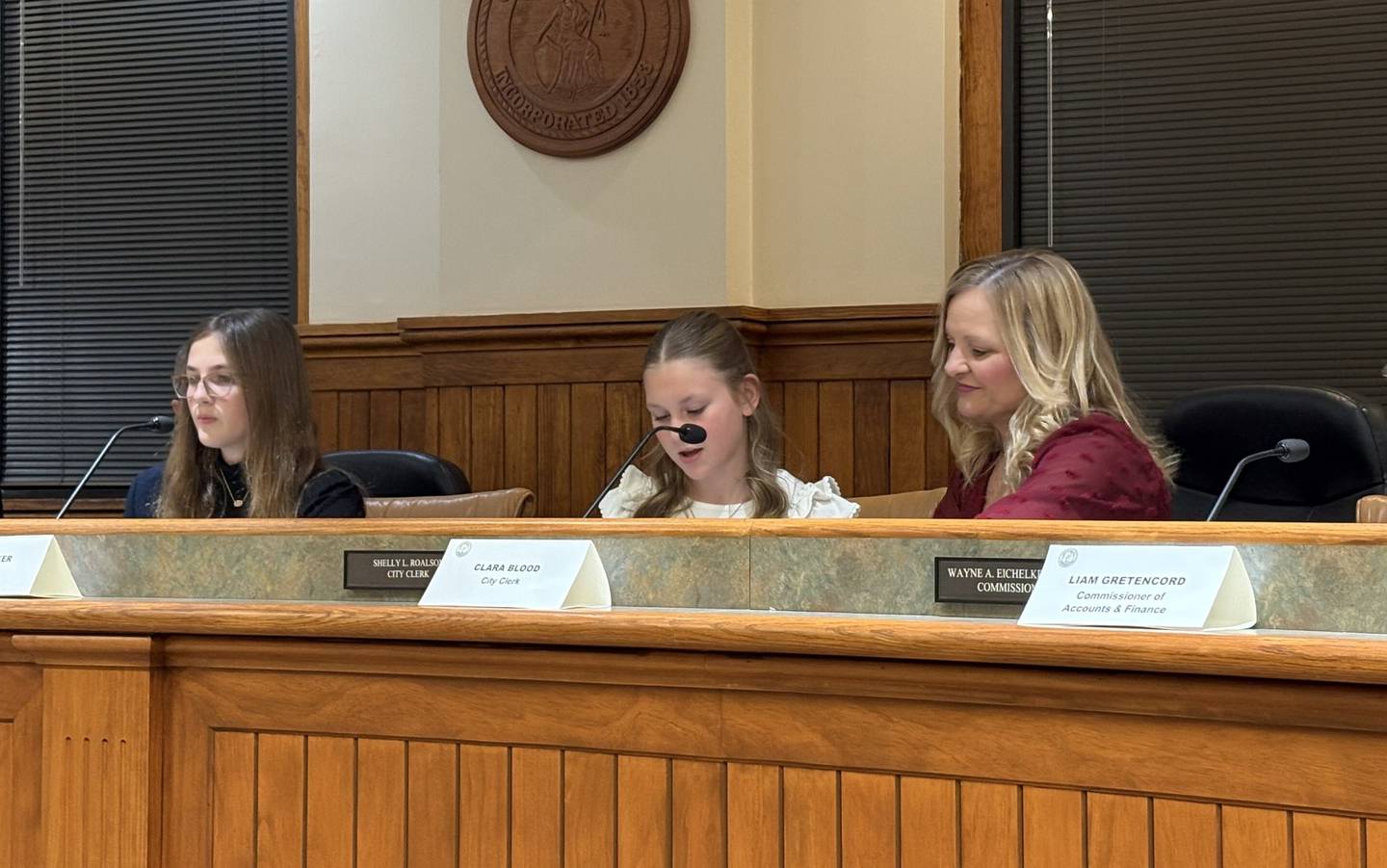 Clara Blood calls the roll as she steps into the role of City Clerk Shelly Roalson during the Kiwanis Kids Club’s mock Ottawa City Council meeting Tuesday night at City Hall.