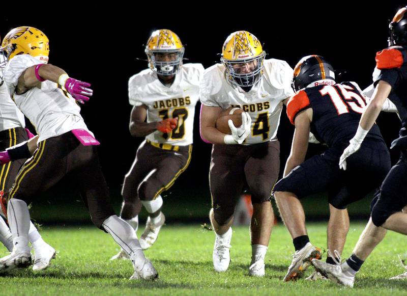 Jacobs’ Paulie Rudolph returns a kickoff in varsity football at Metcalf Field on the campus of Crystal Lake Central Friday night.