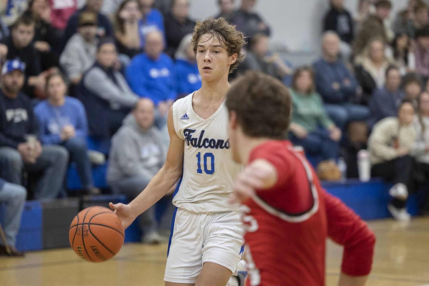 Faith Christian’s Brady Bivins brings the ball up court against QC Christian Tuesday, Dec. 9, 2025.