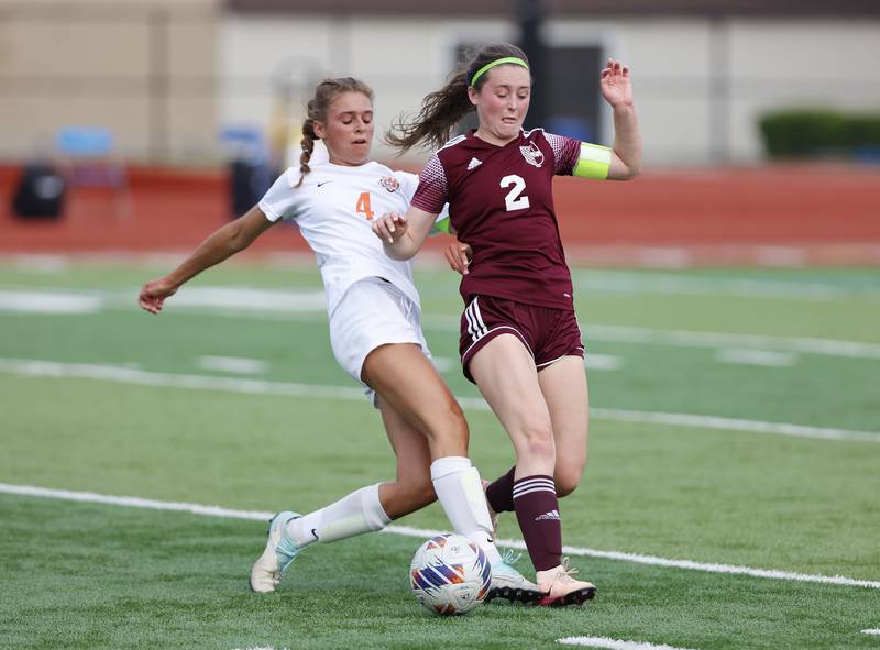 Crystal Lake Central's Hadley Ferrero (4) fights for control of the ball against St. Ignatius' Quinn Urquhart (2) during the 2A girl's varsity supersectional soccer match between Crystal Lake South and St. Ignatius high schools on Tuesday, June 3, 2025 in Chicago.