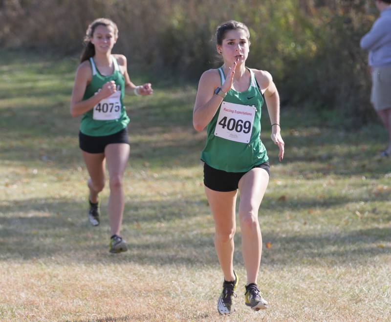 Seneca's Ashley Alsvig and Gracie Steffes run in the Class 1A Regional Cross Country gils race on Saturday, Oct. 22, 2022 at the Seneca FFA Farm in Marseilles.