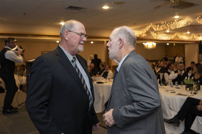 Ace Hardware owner Rich Kelly (left) speaks with Ron Pritchard after the hardware shop was named Business of the Year at the Best of Dixon awards Friday, May 5, 2023.