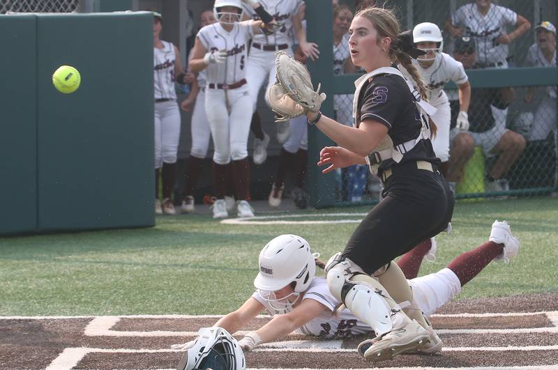 LeRooy's Annie Conn scores a run as the ball gets by Serena catcher RayElle Brennan during the Class 1A Supersectional game on Monday, June 2, 2025 at Illinois Wesleyan Univesity in Bloomington.