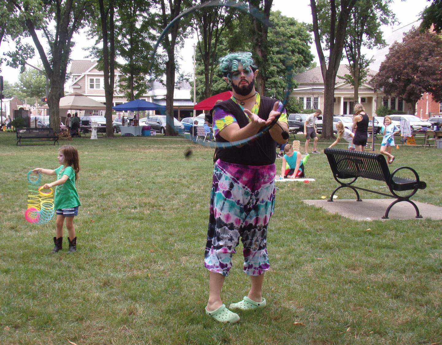 Ky Chameleon shows off skills Saturday, Aug. 13, 2022, with a helper, during the Prairie Fox Books end-of-summer party that coincided with the Ottawa Children's Business Fair at Washington Square.