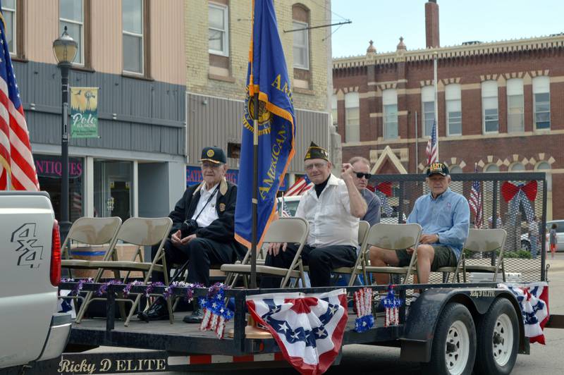 Members of Patrick Fegan American Legion Post No. 83 and Veterans of Foreign Wars Post 8455 ride down East Mason Street during Polo's Memorial Day parade on May 29, 2023. In the front row are American Legion member Richard Jacks, left, and VFW member Riley Bowers. Charles Gall is in the back right.