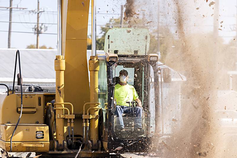 Patrick Burke of Burke Excavating works to clean up a downtown Rock Falls building Tuesday, Oct. 24, 2023.