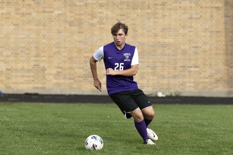 Dixon’s Cooper Fox handles the ball in the defensive zone against Rockford Lutheran Wednesday, Sept. 18, 2024.