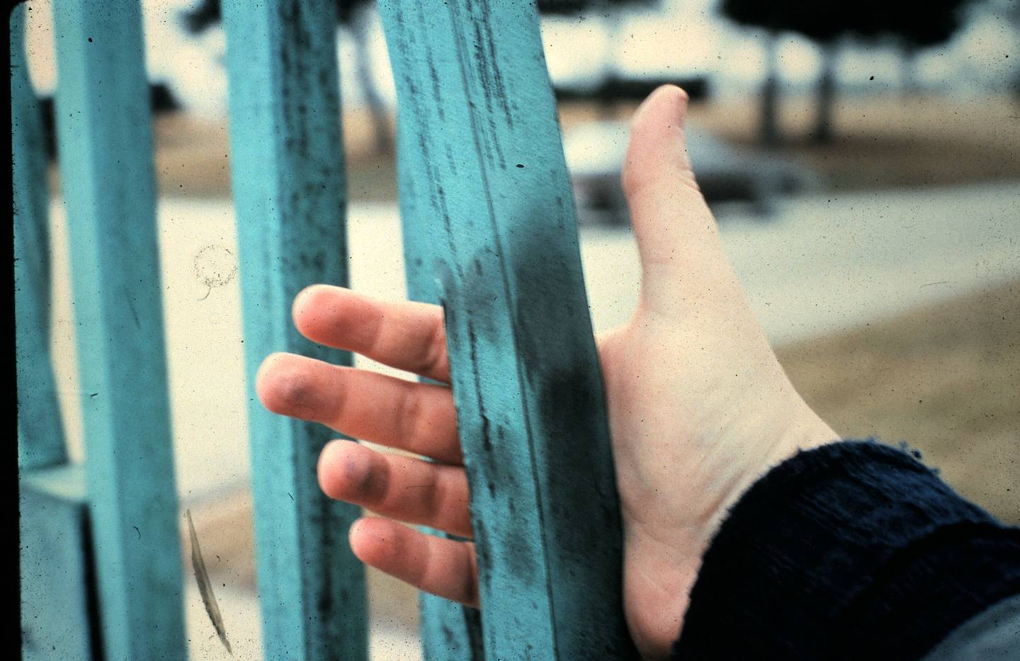 Bent bars in the gate of Resurrection Cemetery appear to have handprints seared into them.