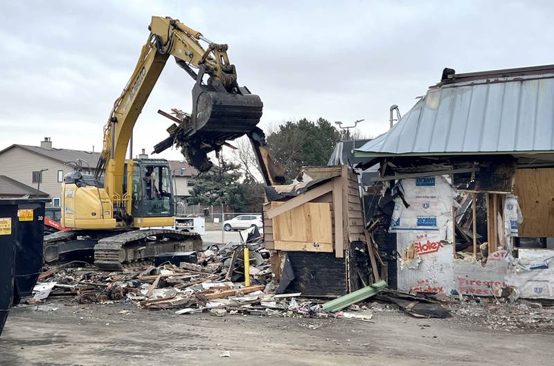 An excavator takes chunks out of Tom & Jerry’s Thursday, Feb. 19, 2026, as teardown is underway at the popular Sycamore restaurant after it was destroyed by fire Jan. 31. The eatery plans to reopen soon at 265 W. Peace Road while they rebuild at the original location.