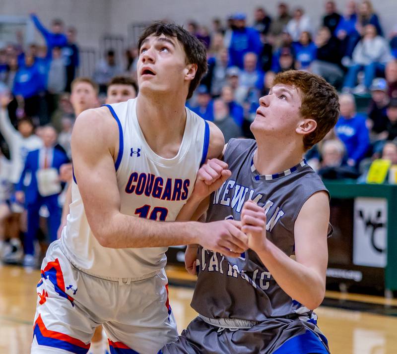 Eastland's Zyacn Haverland and Newman's John Rowzee battle for a rebound during the Class 1A Regional championship at West Carroll on Friday, February 28, 2025.