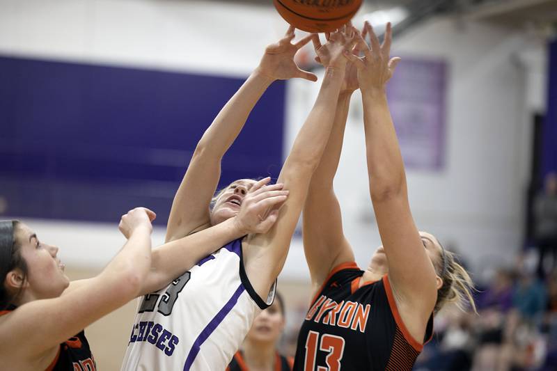 Dixon’s Hannah Steinmeyer works against Byron’s Ella Grundstrom Tuesday, Jan. 24, 2023.