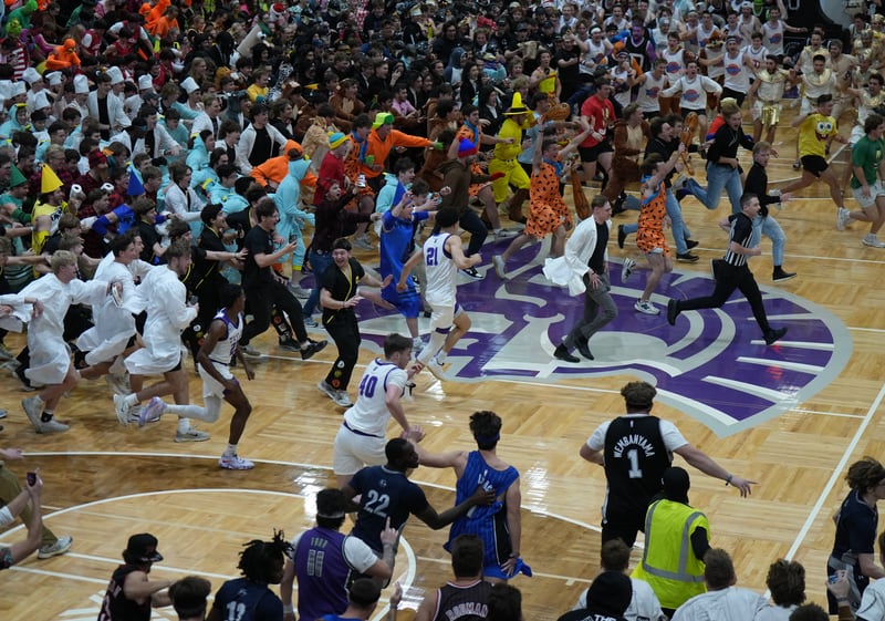 Chaos erupts when Taylor University's scored its 10th point in this year's "Silent Night" game on Dec. 6. Princeton native John Washo (not pictured) and his crew worked the game.