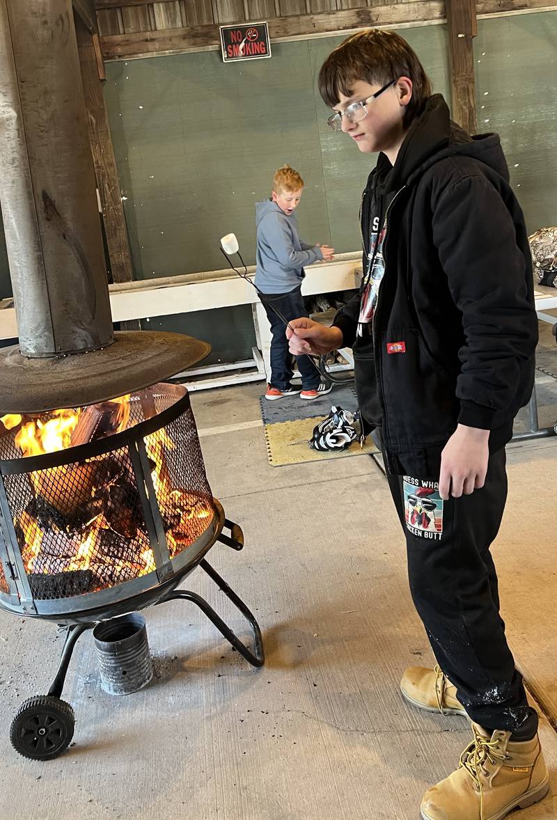 Lucian Laughery gets his marshmallow ready for a s'more post-skating treat at Echo Bluff Park in Spring Valley.