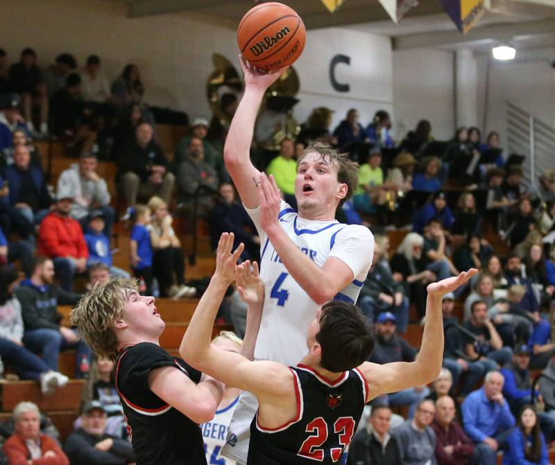 Princeton's Korte Lawson eyes the hoop as Hall's Wyatt West and Braden Curran defend on Friday, Jan. 26, 2024 at Princeton High School.