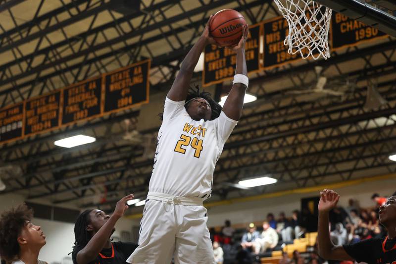 Joliet West’s Micah McNair gets the rebound against Plainfield East on Friday, Dec. 8th, 2023 in Joliet.