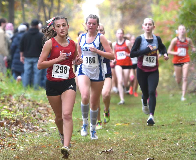 Oregon's Anya Anaya (298) and Sterling Newman's Grace King (386) run at the 1A Winnebago Girls Regional on Saturday, Oct. 25, 2025 at the Levi and Ester Fuller Memorial Forest Preserve. Anaya finished 11th and King  21st.