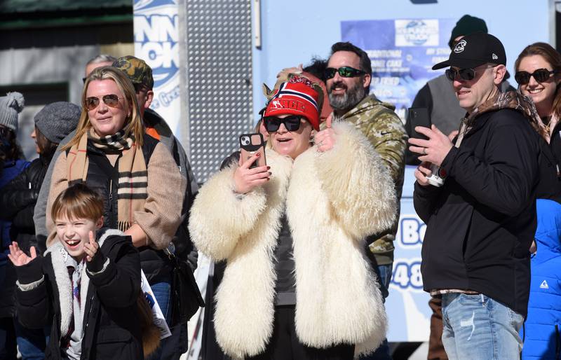 Kate Lacasse of Algonquin gives a thumbs up after her son, Grey, made his jump during the K5 small hills competition during opening day of the Norge Ski Club’s 118th annual Winter Ski Jump Tournament Saturday.