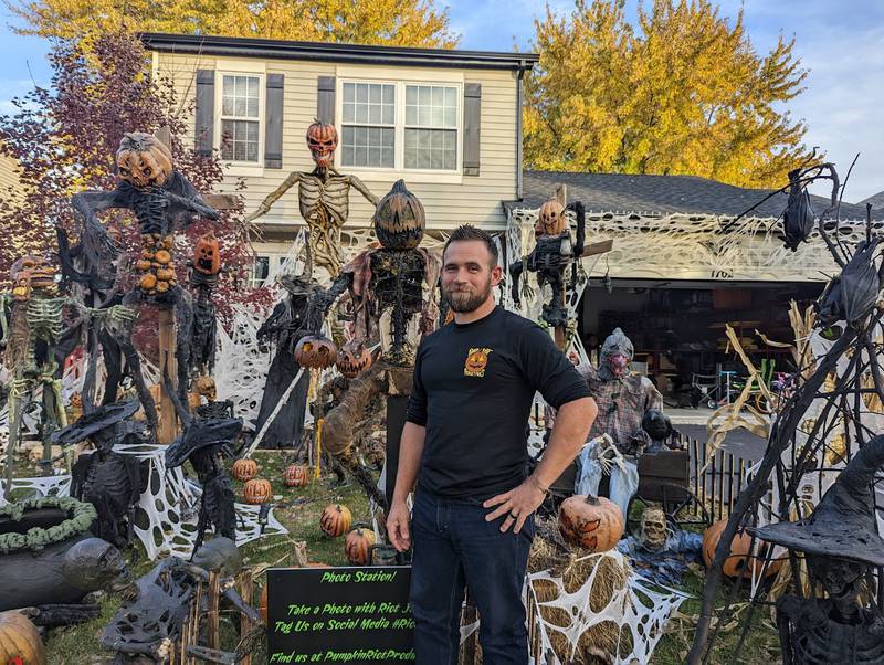 Brian Hunter of Plainfield stands in front of his Pumpkin Riot Productions Halloween exhibit on Saturday, Oct. 29, 2022. Hunter hand-made most of the pieces, carrying on his mother's tradition of making her own Halloween display pieces.