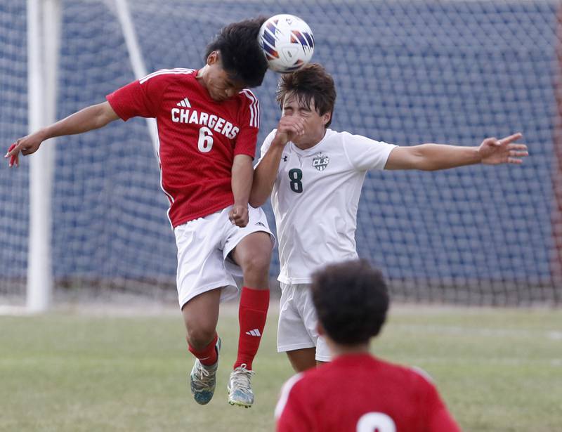 Dundee-Crown's Jonathan Troncoso heads the ball away from Crystal Lake South's Hayden Stone during a Fox Valley Conference soccer match Tuesday, Sept. 5, 2023, at Dundee-Crown High School in Carpentersville.