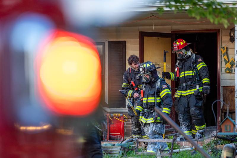 Firefighters walk out of a structure fire on Saturday, July 19, 2025, in the 1400 Block of U.S. Route 6 in Ottawa.